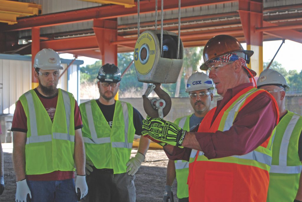 Jeff Ellis working with a group of rigging students.