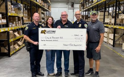 Steve and Jane Napieralski, of OZ Lifting Products, present Chief Pizzano and Lt. Grimes from the Pleasant Hill Police Department with a $12,000 donation for the acquisition and training of a specially imported K9. Trace Erickson, of Code Blue K9, is far right. This dog will be trained in the 2026 course.